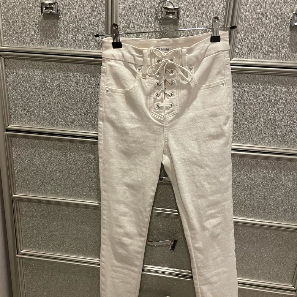 GOOD AMERICAN “good waist crop” lace up jeans in white.